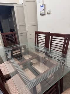 Pure wooden dining table with 12 mm tinted glass