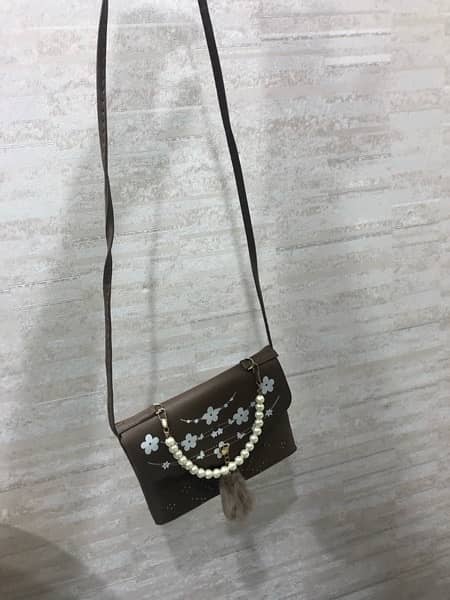 Women crossbody bag brown color 1