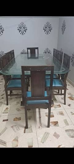 8 chairs dininning table . . . sheesham wood. . thick glass on top. .