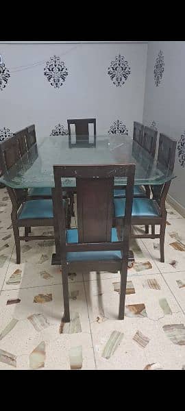 8 chairs dininning table . . . sheesham wood. . thick glass on top. . 0