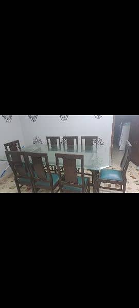 8 chairs dininning table . . . sheesham wood. . thick glass on top. . 1