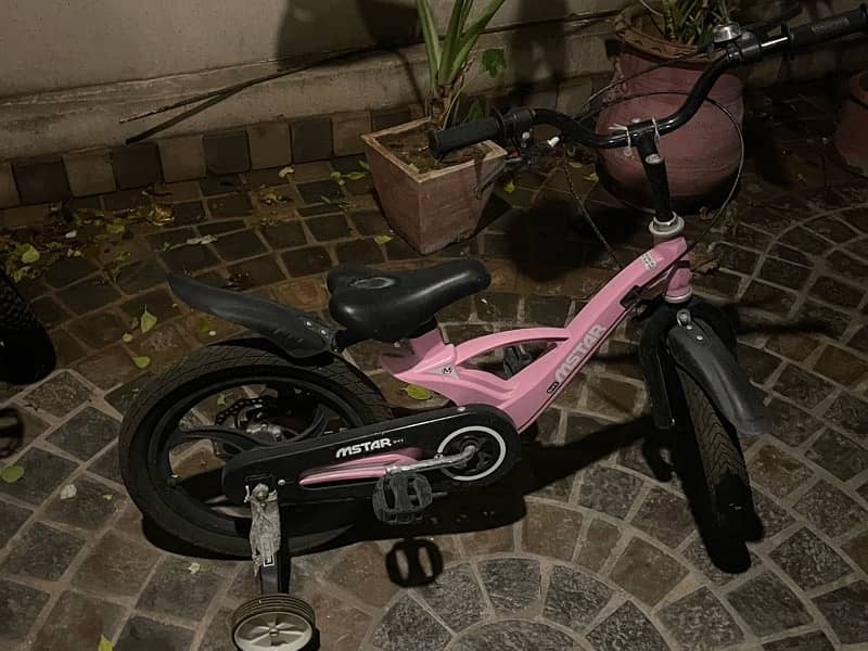 selling pink childrens bicycle in perfect unused condition 0