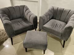 2 sofa chairs with tea table