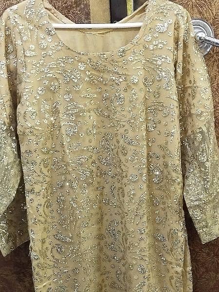 2pc , formal dress with golden color work. what's app num 03234950058 1