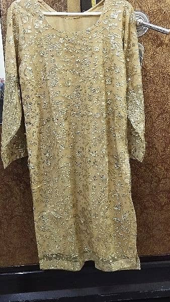 2pc , formal dress with golden color work. what's app num 03234950058 2