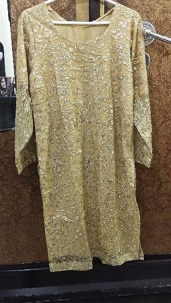 2pc , formal dress with golden color work. what's app num 03234950058 4