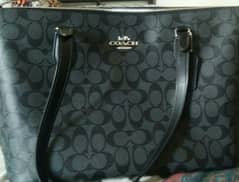 original coach brand bag. black colour new.