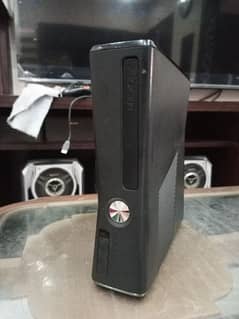 Xbox 360 slim new scratchless condition with original box and 24 games