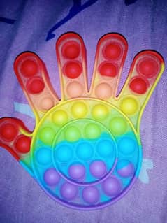 puppet with a rainbow colour hand shape 0