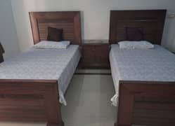 2 wooden beds with molty foam mattresses