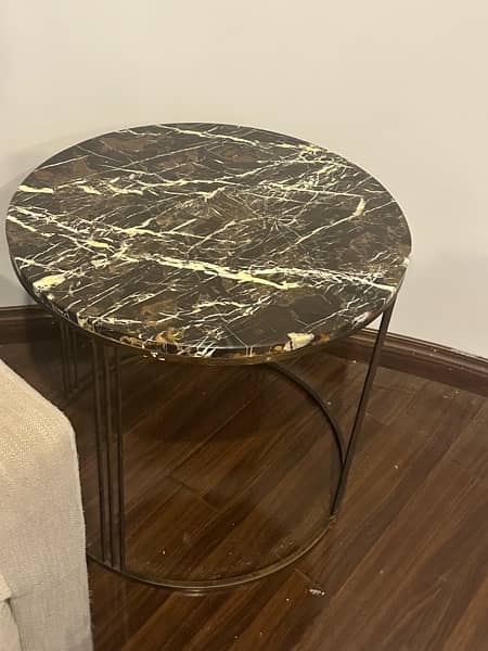 its a side table with a black marble 1