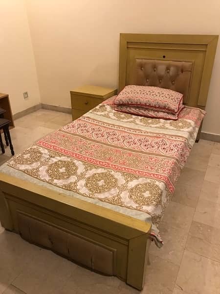 single bed with side table 0