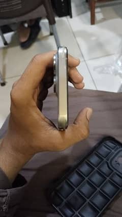 iPhone 15 pro max with apple watch and charger