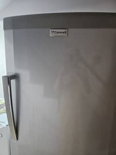 Vertical  freezer. . . CAREVELL. . . Good condition