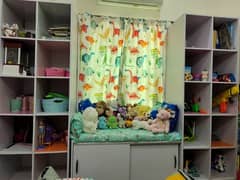 toy storage rack and couch