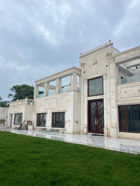 White limestone House exterior work with carving 1