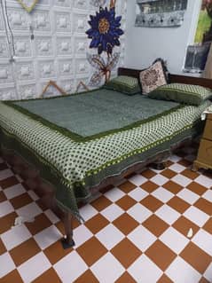 one bed wooden with double springs foam