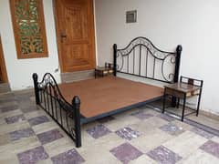 Wrought iron double bed with side table (used). Urgent sale