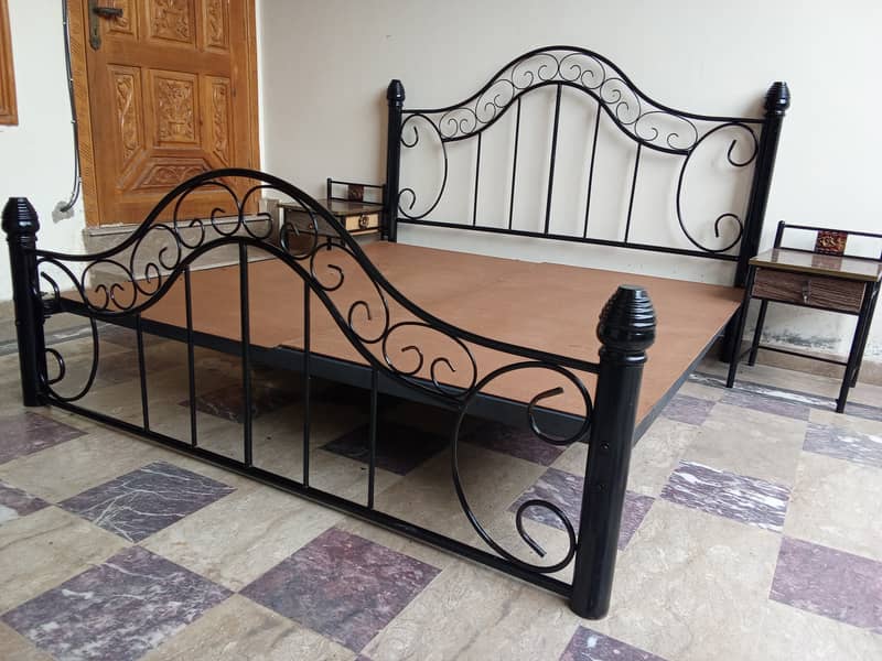 Wrought iron double bed with side table (used). Urgent sale 1