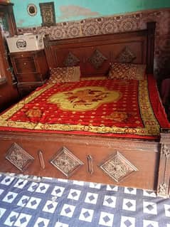 bed with mattress and two side tables