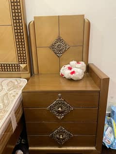 wooden bed with sidetables