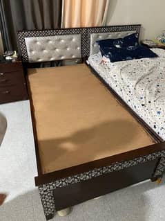 2 beds and 2 side tables