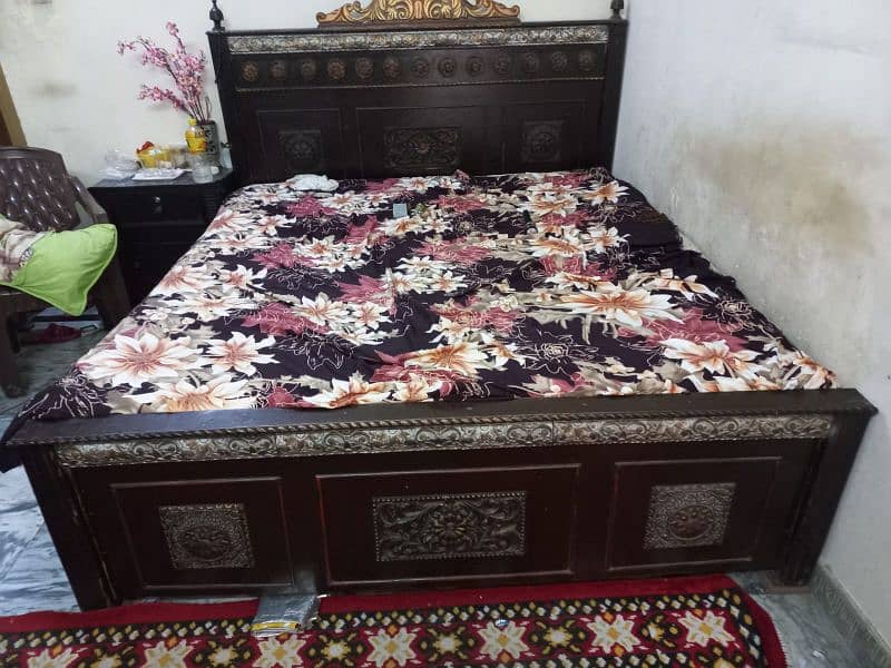 wooden bed with mattress 0