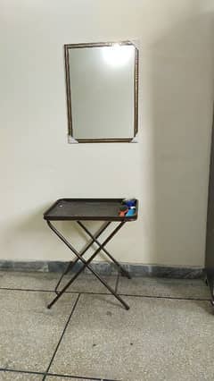 Folding table with mirror