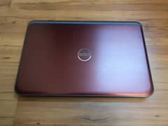 DELL INSPIRON 5735 IN MAROON AND IN GOOD SPECS AND DECENT CONDITION