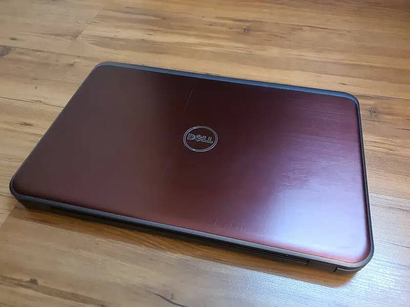 DELL INSPIRON 5735 IN MAROON AND IN GOOD SPECS AND DECENT CONDITION 1