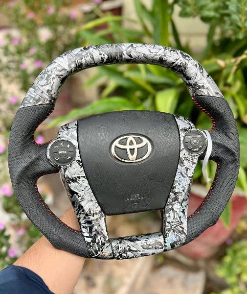 Toyota Prius + Aqua carbon fiber steering available 1