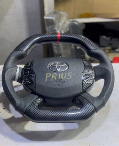 Toyota Prius + Aqua carbon fiber steering available 2