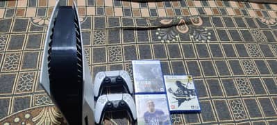 PS5 with extra controller and games