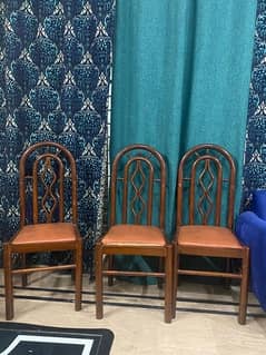 Dining table with glass top and 6 wooden chairs