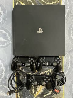 PS4 PRO with 3 controllers and 14 CDs