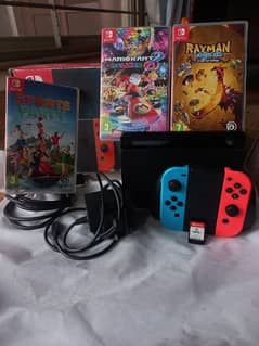 Nintendo Switch with assecories including box. 3 games also available.