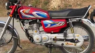 Honda 125 red colour , my contact no. 03009870056