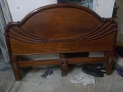 wooden bed in good condition with out mattress