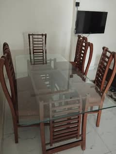 Glass top wooden Dining Table with six chairs, urgent sale