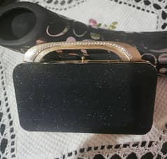 Clutches ( fashion purses ] in Golden and Black colour