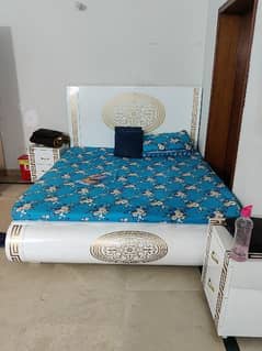 slightly used versachi bed with side tables