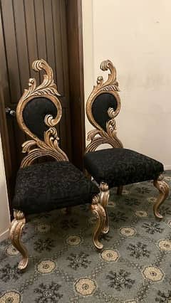 Carved chairs with leafing