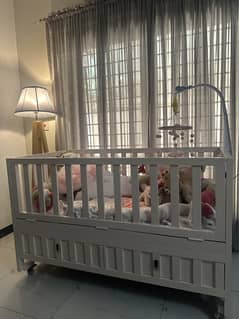 Wooden baby cot with mattress