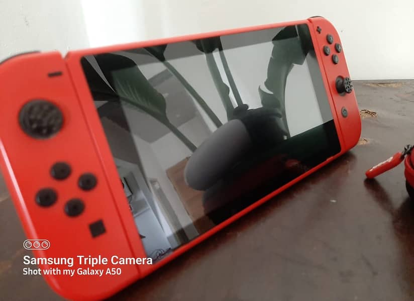 Nintendo switch V2 Dual boot Mario edition just like new with ipega 2