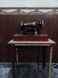 Motor sweing machine with table stand