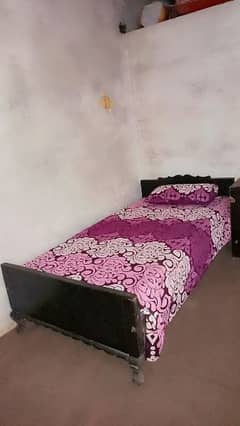 single bed with side table