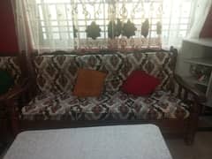 7 setter sofa in good condition with 1 wood table