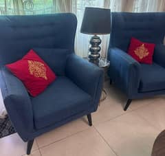 Two sofa chairs in blue colour