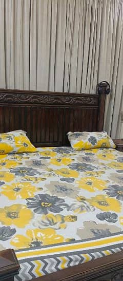 king size bed along with 2 side tables and spring mattress