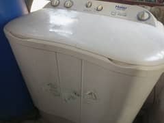 Semi automatic washer and dryer haier machine in operational condition 0